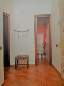 a bathroom with a toilet and a stool in a room at villa nonna nina in Capaci +51 photos