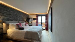 Voodi või voodid majutusasutuse Zenith Views by Villars Luxury toas