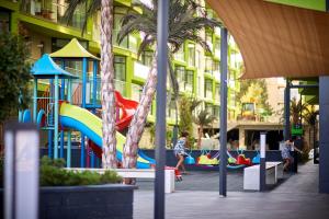 a playground in a building with children playing on it at CRYSTAL ApartHotel & Spa Mamaia Nord in Mamaia Sat/Năvodari +26 photos