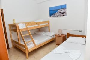a bunk bed room with two beds and a ladder at Sangiovanni in Shëngjin +43 photos