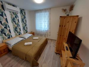 Posteľ alebo postele v izbe v ubytovaní Kempi Kuckója