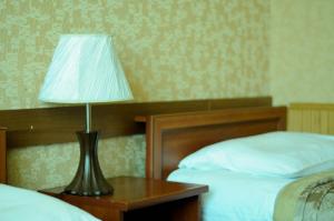 Posteľ alebo postele v izbe v ubytovaní Don Kihot Hotel