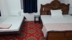 Кровать или кровати в номере Royal Panorama