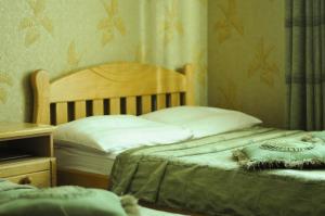 Posteľ alebo postele v izbe v ubytovaní Don Kihot Hotel