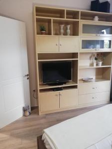 A television and/or entertainment centre at NICOL APARTMENS