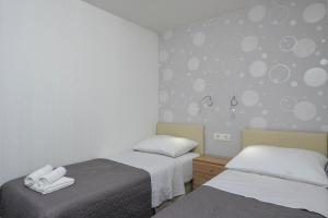 Postel nebo postele na pokoji v ubytování Larisa