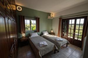 Posteľ alebo postele v izbe v ubytovaní Villa Georgina B&B