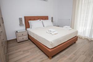 Ліжко або ліжка в номері Raise Kifisias Serviced Apartments