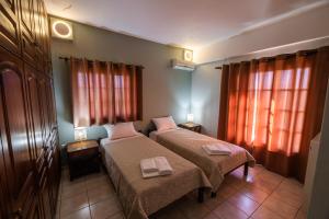 Posteľ alebo postele v izbe v ubytovaní Villa Georgina B&B