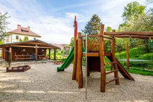 a playground with a slide and a pavilion at Penzion, restaurant Gloria in Chrastava