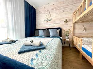 Posteľ alebo postele v izbe v ubytovaní Harbour View Gdynia