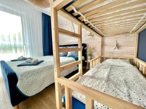 Posteľ alebo postele v izbe v ubytovaní Harbour View Gdynia