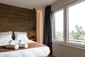 Un pat sau paturi într-o cameră la Le Mont Rigi