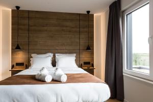 Postel nebo postele na pokoji v ubytování Le Mont Rigi