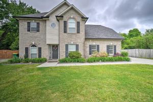 a house with a grass yard at Home Sweet Home with Private Pool and Patio! in Knoxville