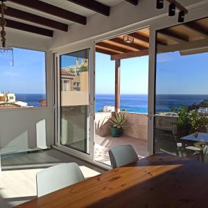 a dining room with a view of the ocean at Enjoy Morro Jable in Morro del Jable +18 photos