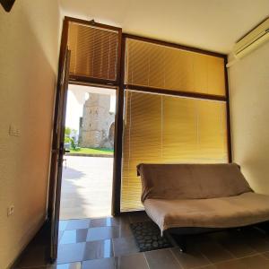 a room with a window with blinds and a bed at Apartment Kristjan in Portorož