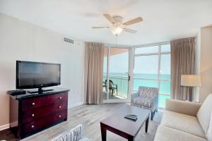 a living room with a flat screen tv and a couch at Prince Resort 1708 in Myrtle Beach