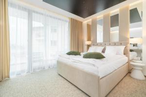 מיטה או מיטות בחדר ב-Axel Baltic Jacuzzi & Sauna