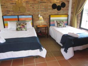 Postel nebo postele na pokoji v ubytování Ecohotel, Finca Colinas y Senderos