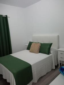 Ein Bett oder Betten in einem Zimmer der Unterkunft Heva Home