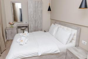 Postel nebo postele na pokoji v ubytování Hotel Pazari & Apartments