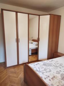a bedroom with sliding glass doors and a bed at Apartment MM Split in Split