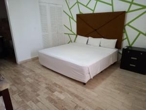Postel nebo postele na pokoji v ubytování Nirvana Hotel - Cancun Hotel Zone