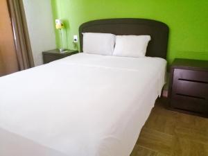 Postel nebo postele na pokoji v ubytování Nirvana Hotel - Cancun Hotel Zone