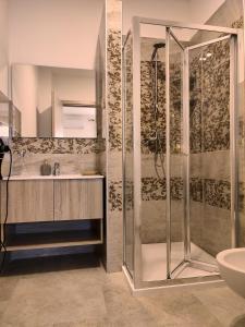 a bathroom with a shower and a sink at B&B San Vito in Tricase