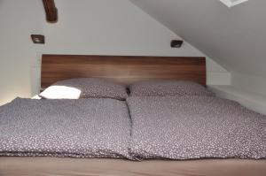 Posteľ alebo postele v izbe v ubytovaní MW Apartman
