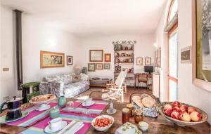 a living room with a table with fruits on it at Casa Il Gumo in Varese Ligure