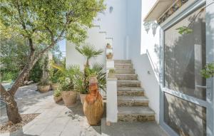 a large vase sitting on the side of a building at La Casa Di Marina in Marittima