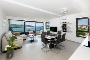 a living room with a couch and a table at Apartment MaLu in Banjole