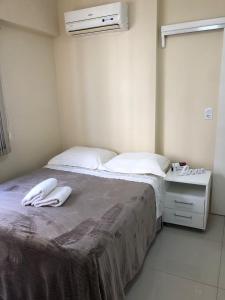 Katil atau katil-katil dalam bilik di PÉ NA AREIA - Suíte à beira-mar com garagem
