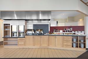 Kuchyň nebo kuchyňský kout v ubytování Stav Hotel