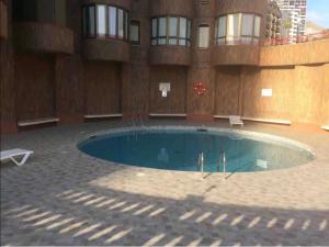 Bazén v ubytování Apartamento playa nebo v jeho okolí