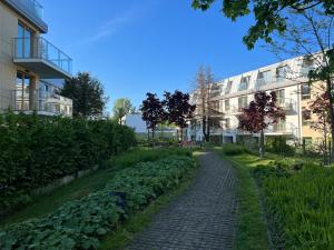 a brick path in front of a building at Apollo Luxury Apartment Dolny Sopot in Sopot