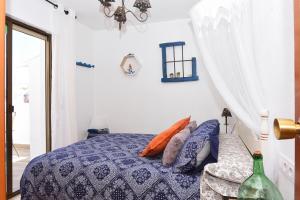 Кровать или кровати в номере Ático con encanto en Cabo de Gata. A 100m de la playa.