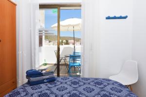 Кровать или кровати в номере Ático con encanto en Cabo de Gata. A 100m de la playa.