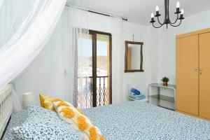 Кровать или кровати в номере Ático con encanto en Cabo de Gata. A 100m de la playa.