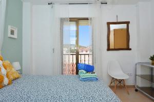 Кровать или кровати в номере Ático con encanto en Cabo de Gata. A 100m de la playa.