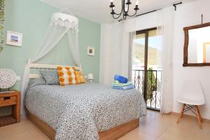 Кровать или кровати в номере Ático con encanto en Cabo de Gata. A 100m de la playa.
