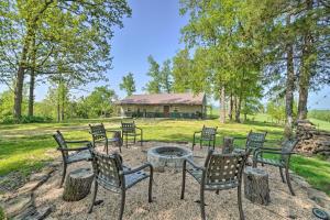 a group of chairs sitting around a fire pit at Relaxing Rural Harrison Home - 11 Mi to Town in Harrison
