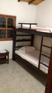 a room with two bunk beds in a room at Cabaña Milan in San Gil