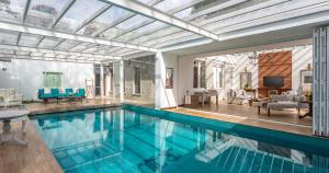 a large swimming pool in a house with a living room at W15 Lake Gregory in Nuwara Eliya
