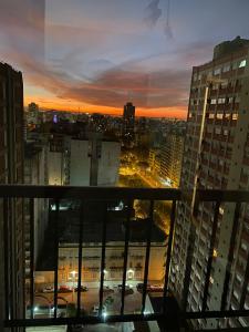 a view of a city at sunset from a building at Arena1 in Mar del Plata +28 photos