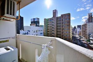 a balcony with a view of a city at Crest YS Chiyoda 7C in Aoichō