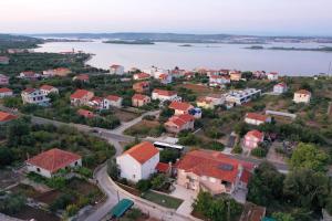an aerial view of a small town next to a body of water at Apartments BoBo in Kraj