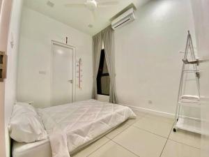 Ένα ή περισσότερα κρεβάτια σε δωμάτιο στο Le Pavilion Puchong 4-6pax 2R2B